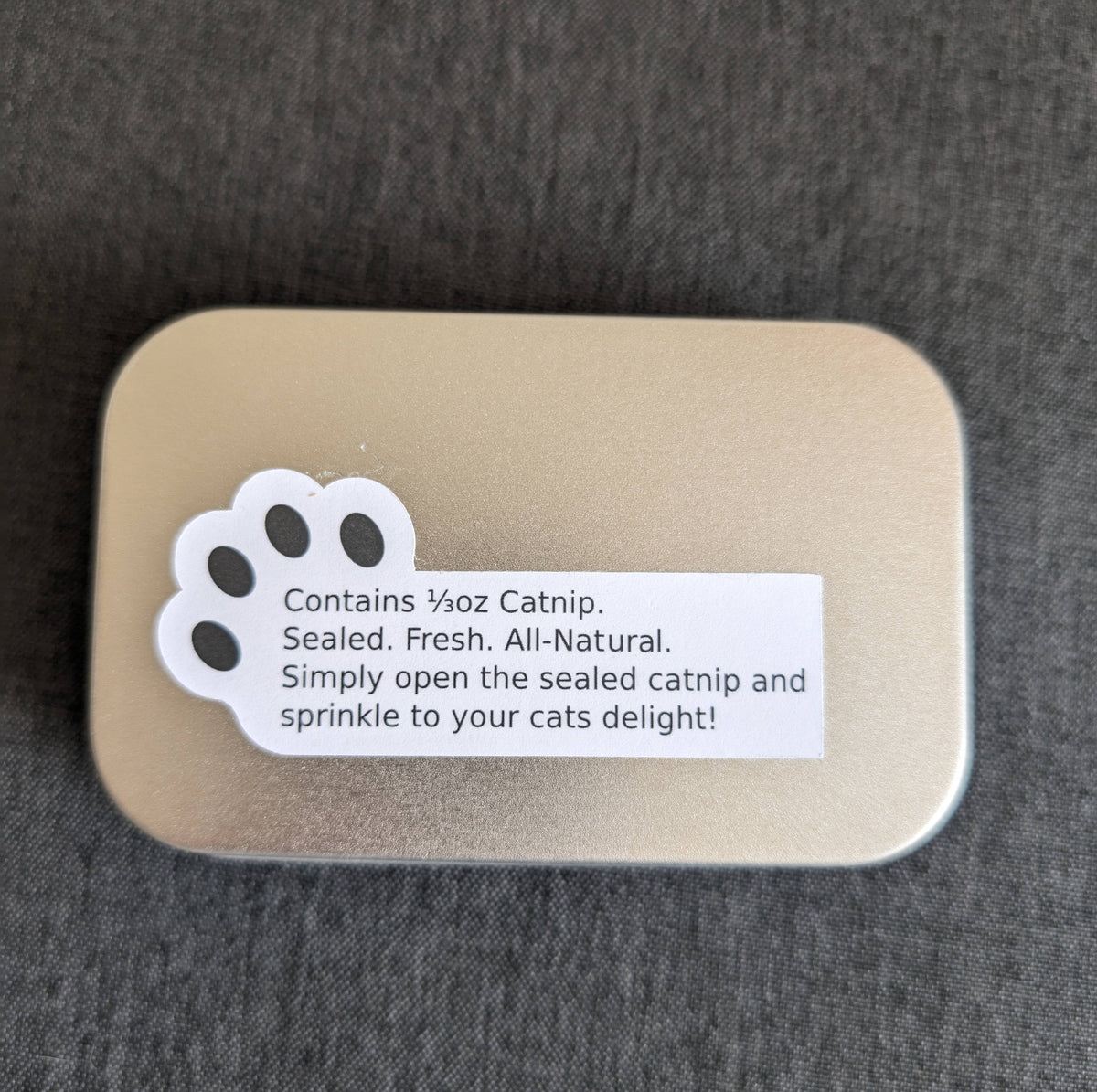 Catnip Tin with 1/3rd oz of freshly sealed catnip.